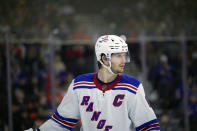 FILE - New York Rangers' Jacob Trouba plays during an NHL hockey game, Friday, Nov. 24, 2023, in Philadelphia. Jacob Trouba is far more than a hockey player. In fact, the New York Rangers captain might be the most interesting man in the NHL. Trouba asked for a trade to the U.S. to make sure his then-fiancée could pursue her medical career, was the first and only player to agree to have his photo taken getting the COVID-19 vaccine, paints artwork on the side and met with Fortune 500 CEOs about leadership before he got the ‘C.' (AP Photo/Matt Slocum, File)