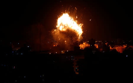 An explosion is seen during an Israeli air strike on Hamas's television station, in Gaza City November 12, 2018. REUTERS/Ahmed Zakot