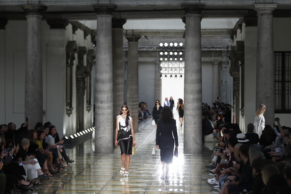 Models wear creations as part of the Bottega Veneta Spring-Summer 2020 collection, unveiled during the fashion week, in Milan, Italy, Thursday, Sept. 19, 2019. (AP Photo/Antonio Calanni)