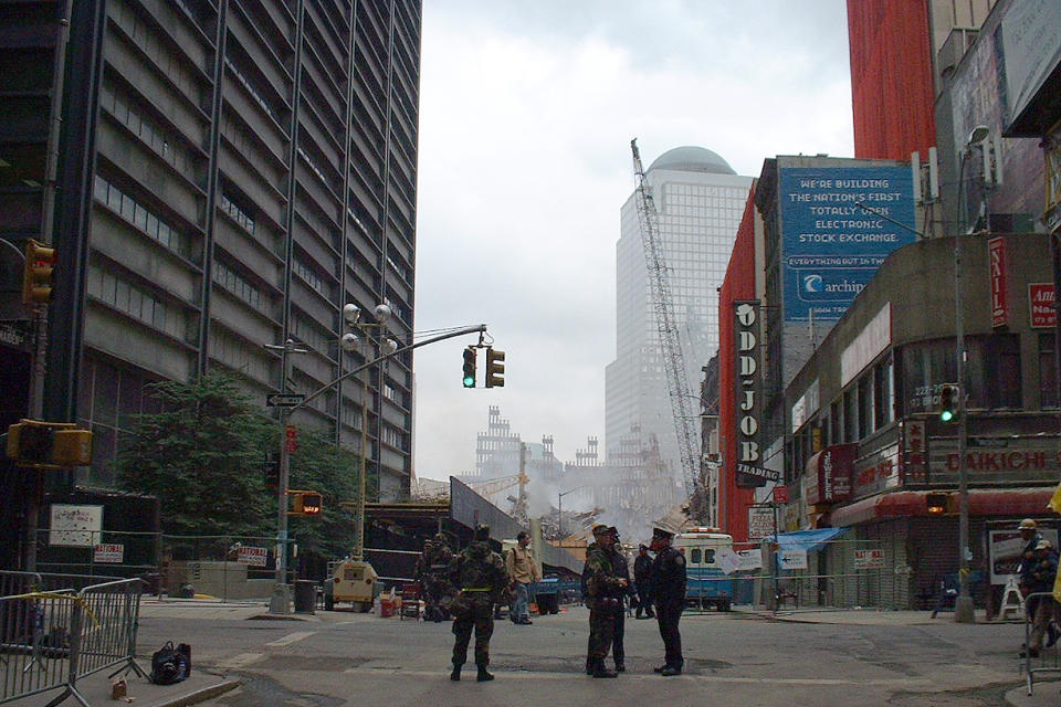 <p>The skelton of one of the twin towers is seen as emergency personal keep the area secure on Sept. 19, 2001. (Photo: Gordon Donovan/Yahoo News) </p>