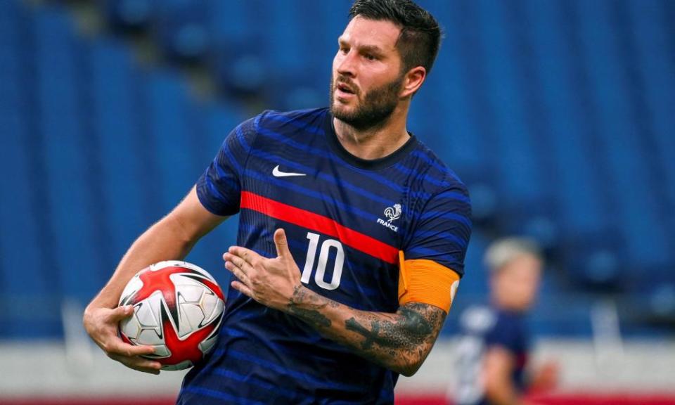 Andre-Pierre Gignac, one of France’s over-age players, celebrates a goal in Japan.