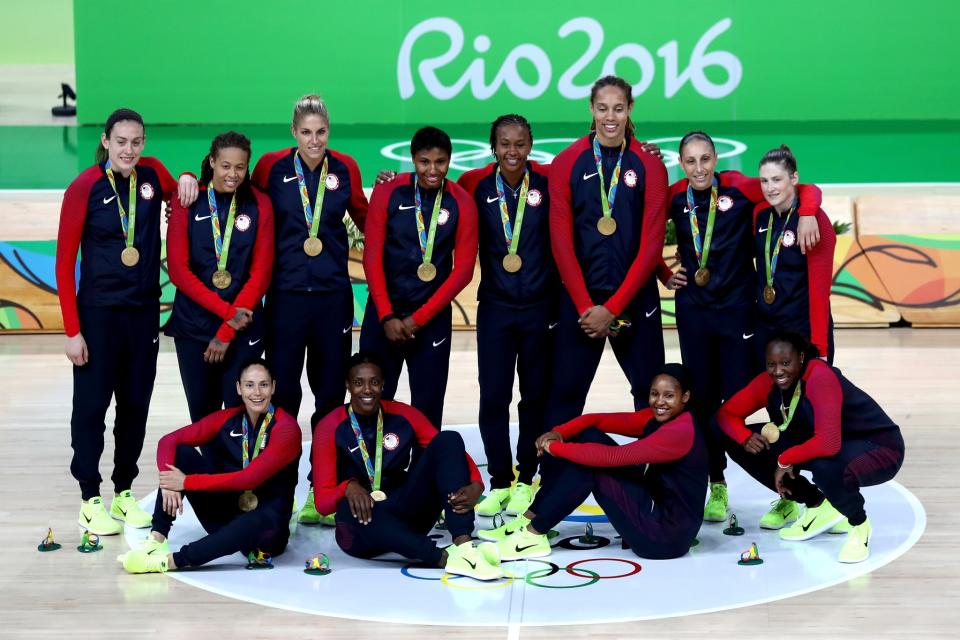 <p>Gold medalists Team USA celebrate during the medal ceremony after the Women’s Basketball competition on Day 15 of the Rio 2016 Olympic Games at Carioca Arena 1 on August 20, 2016 in Rio de Janeiro, Brazil. (Photo by Sean M. Haffey/Getty Images) </p>