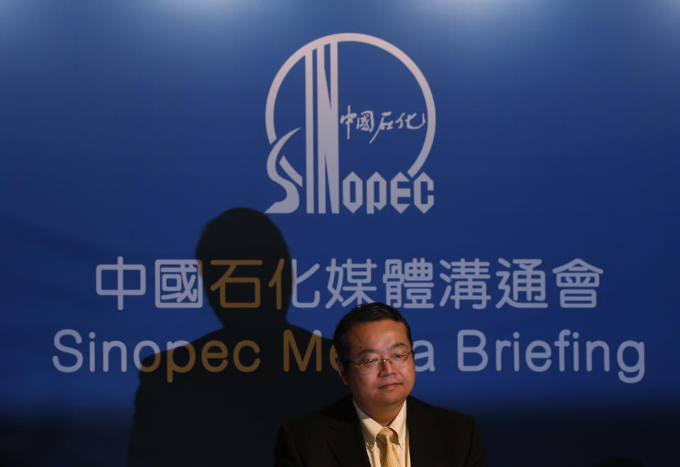 Sinopec representative, Vice President of Sinopec Chemical Commercial Holdings Company Ltd. Zhang Guoming attends a press conference in Hong Kong Thursday Aug. 9, 2012. Chinese oil company Sinopec, Thursday, is promising to clean up millions of its tiny plastic pellets that washed up on beaches across Hong Kong after they fell off a ship during a strong typhoon. (AP Photo/Kin Cheung)