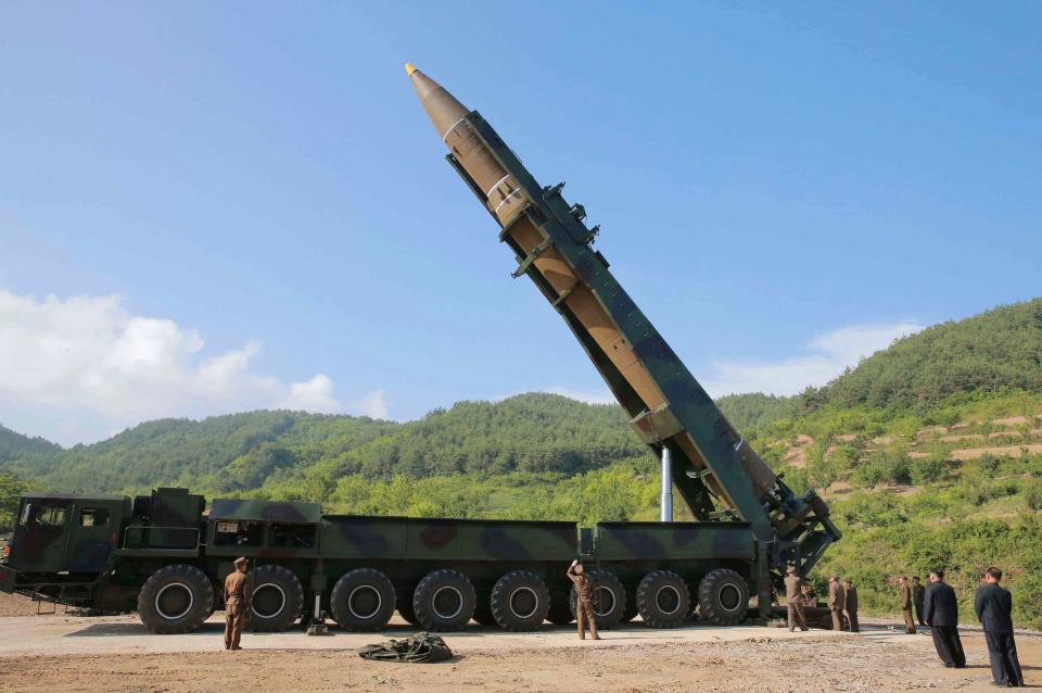 Kim Jong Un, second from right, inspects the preparation of the launch of a Hwasong-14 intercontinental ballistic missile - Credit: Korean Central News Service/AP