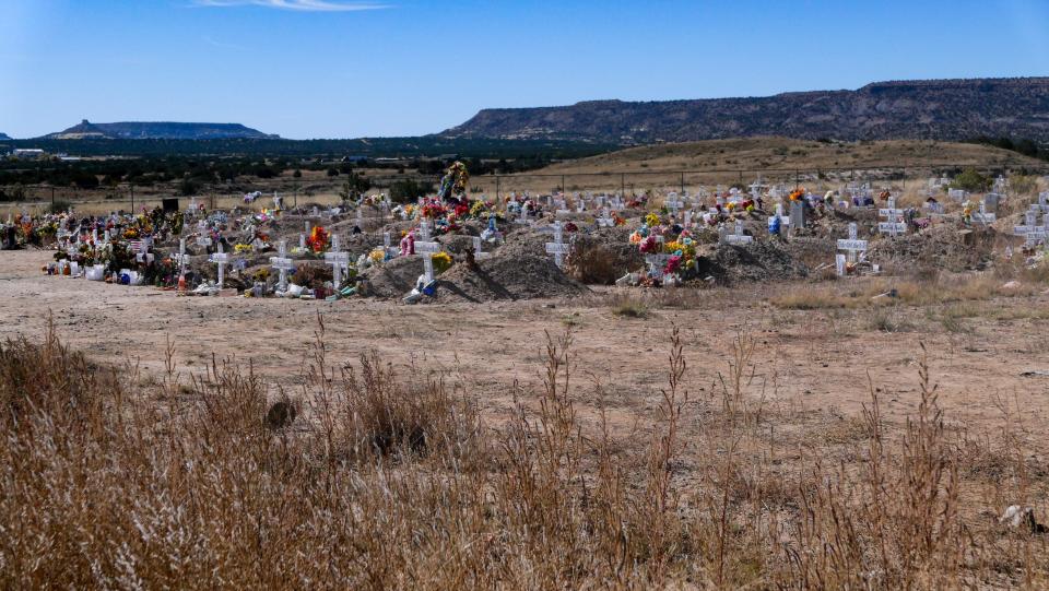 Fresh flowers mark the graves of recently buried members of the tribe, many of whom succumbed to COVID-19, at the Laguna Pueblo cemetery. The tribe expanded the cemetery in response to the COVID-19 death toll. 