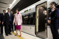 Ma Xingrui, governor of Guangdong Province, and Carrie Lam, Hong Kong's chief executive, stand next to a Guangzhou-Shenzhen-Hong Kong Express Rail Link (XRL) Vibrant Express train bound for Guangzhou Nan Station on a platform in the Mainland Port Area at West Kowloon Station, which houses the terminal for the XRL, developed by MTR Corp., in Hong Kong, China, September 22, 2018. Giulia Marchi/Pool via REUTERS