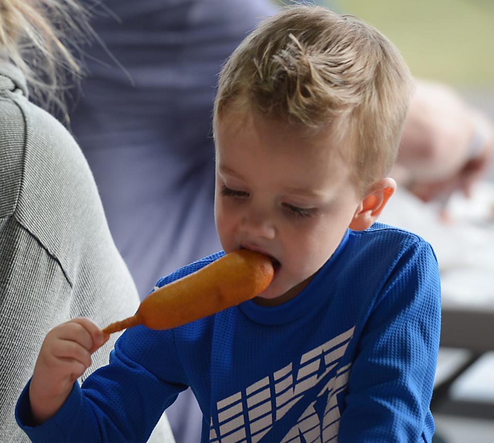 The Piedmont Interstate Fair gates will be open in Spartanburg  October 11-16. Luke Watson, 3, of Woodruff eats his corn dog. 