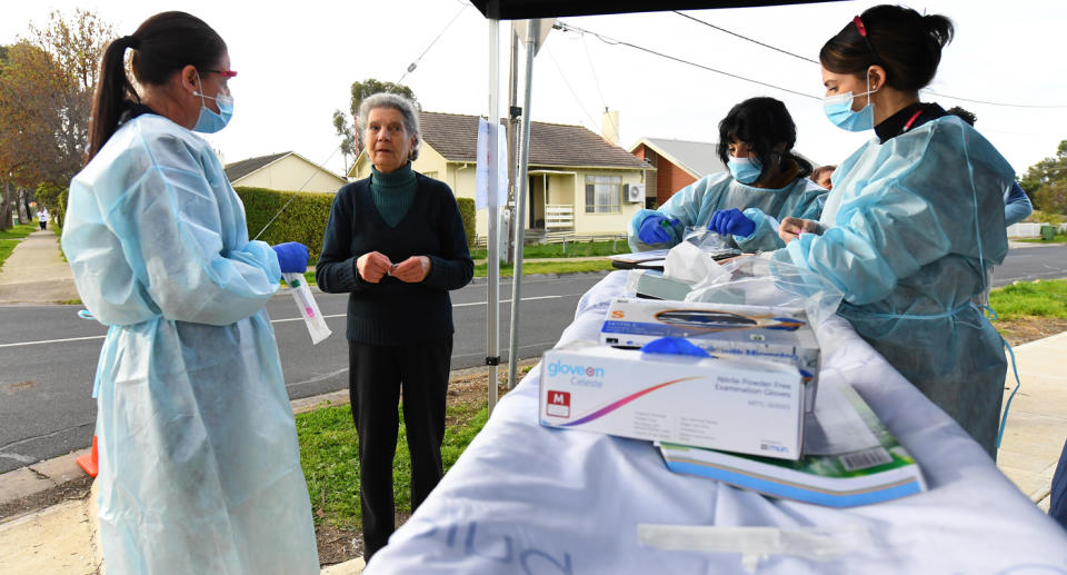 A resident shown at a pop-up COVID-19 test in Broadmeadows, one of Melbourne's 10 hotspots. Source: AAP