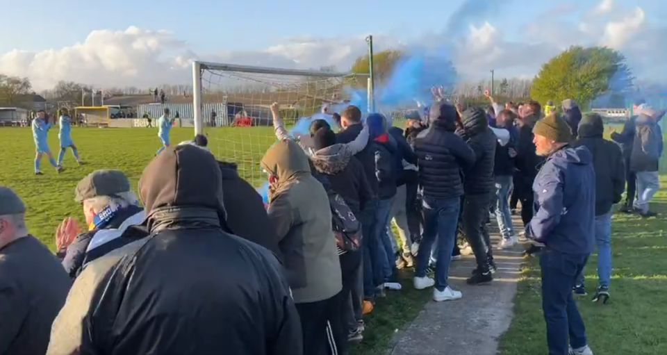 Enfield Town fans celebrate at the final whistle (X/@tomkingham)