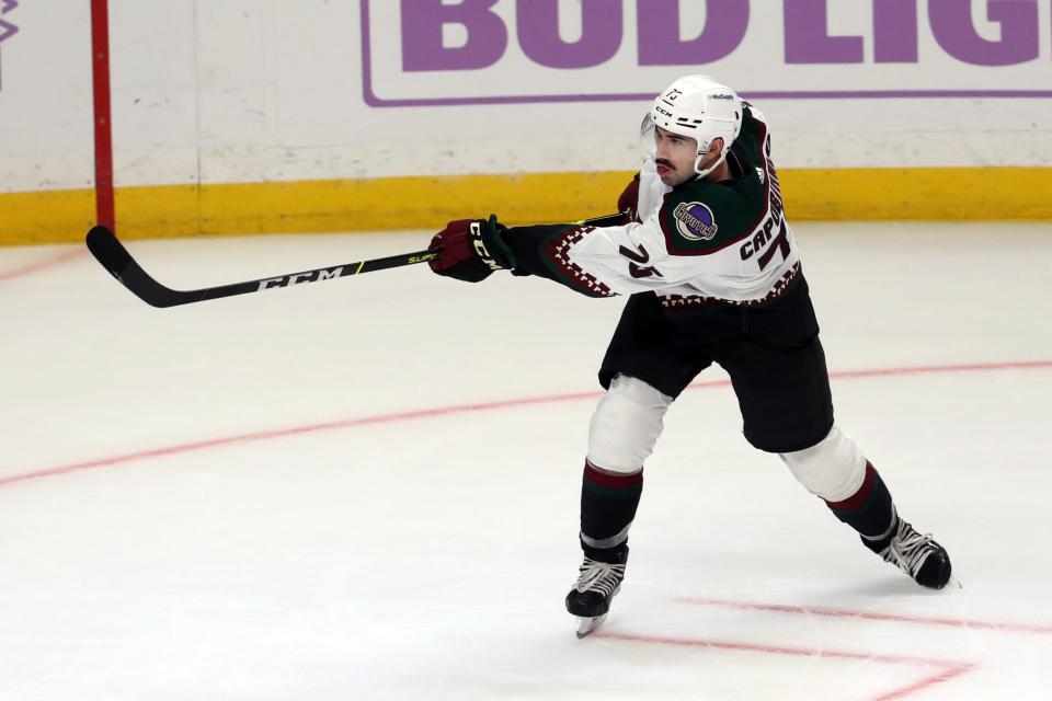 Nov 21, 2021; Los Angeles, California, USA; Arizona Coyotes defenseman Kyle Capobianco (75) shoots the game winning shot in the overtime against Los Angeles Kings at Staples Center. The Coyotes wins 2-1. Mandatory Credit: Kiyoshi Mio-USA TODAY Sports