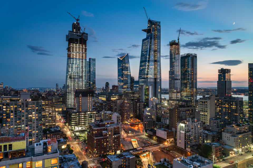 Large scale development projects are underway on the far west side of Manhattan near 34th Street and the Hudson River. This high angle view above Ninth Avenue looks south toward Manhattan West and Hudson Yards, two of the large development projects. Seen in the background are the Hudson River and Jersey City. Also seen in the foreground are access roads to the Lincoln Tunnel.