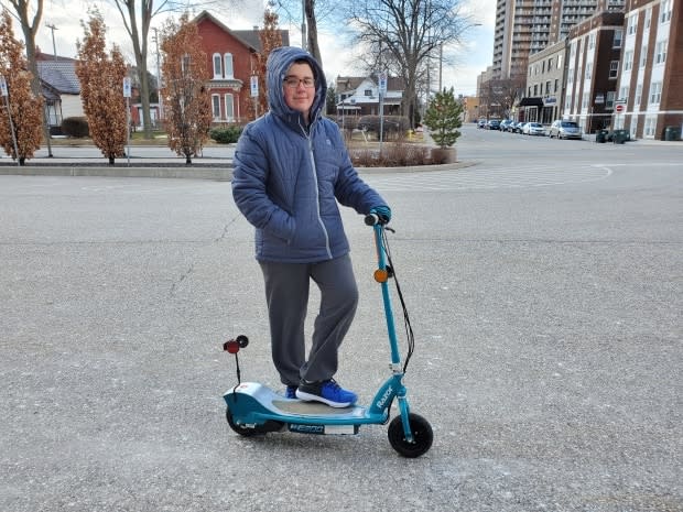 Jason Riley Evon says e-scooters are a great way to get around, especially for someone like him who has asthma.  (Tahmina Aziz/CBC - image credit)