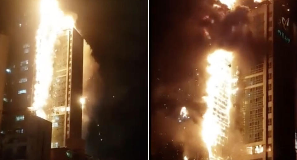 A building is completely engulfed in fire.