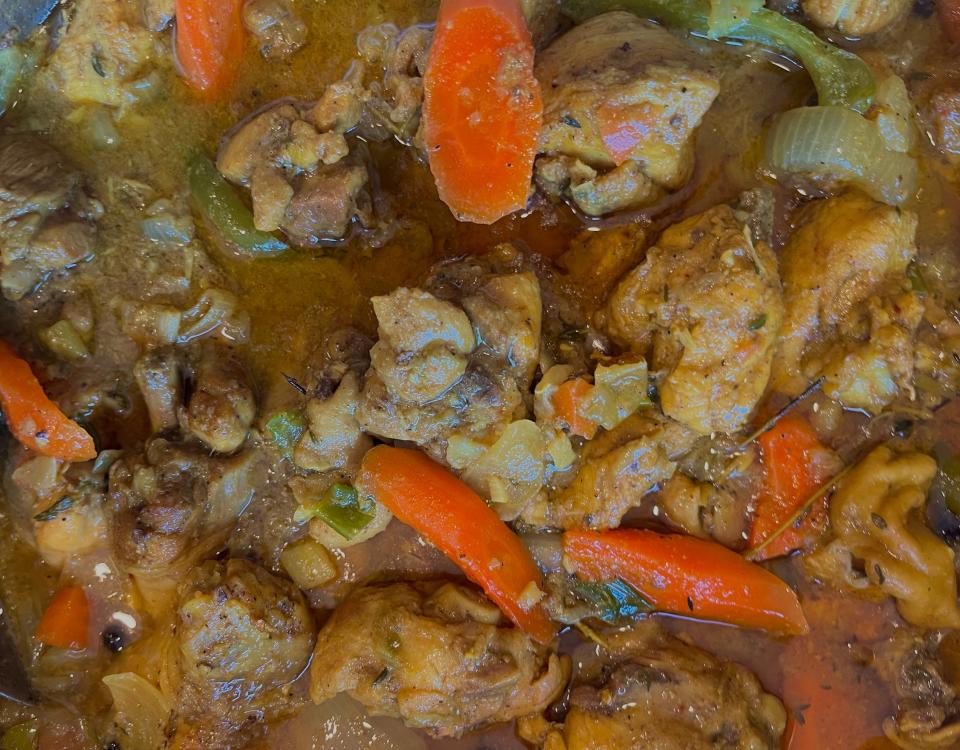 Tender curry chicken with carrots, onions, green peppers and thyme.