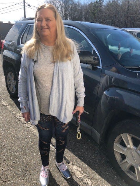 60-year-old Dallas resident Samantha Hill standing next to her car on Feb. 2, 2024, the day after being the victim of an alleged carjacking.