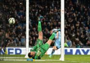Manchester City's English midfielder James Milner (R) celebrates scoring a goal past Leicester City's Australian goalkeeper Mark Schwarzer during their English Premier League football match in Manchester, England, on March 4, 2015