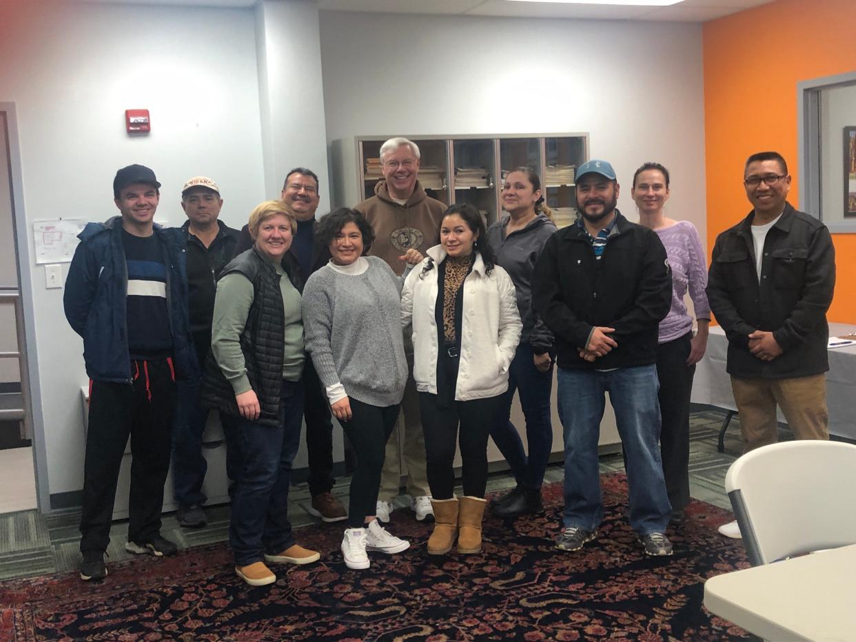 Students and tutors in the U.S. citizenship class pose for a phot at La Casa de Amistad in South Bend. La Casa offers three, 10-week courses a year to help people prepare for the test.