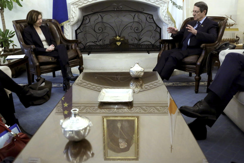 France's Defense Minister Florence Parly, left, talks with Cyprus' President Nicos Anastasiades during their meeting at the Presidential palace in capital Nicosia, Cyprus, Tuesday, Feb. 18, 2020. Parly said on Tuesday that her country stands in solidarity with Cyprus amid tensions over a Turkish search for natural gas inside Cypriot waters. (AP Photo/Petros Karadjias)