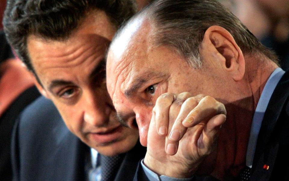 French President Jacques Chirac, right, listens to his Interior Minister Nicolas Sarkozy during a Franco-Spanish summit in Paris -  Christophe Ena/AP