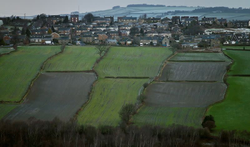 FILE PHOTO: A housing estate is seen next to farmers' fields in the Hallam constituency of Britain's Deputy PM Clegg in Sheffield