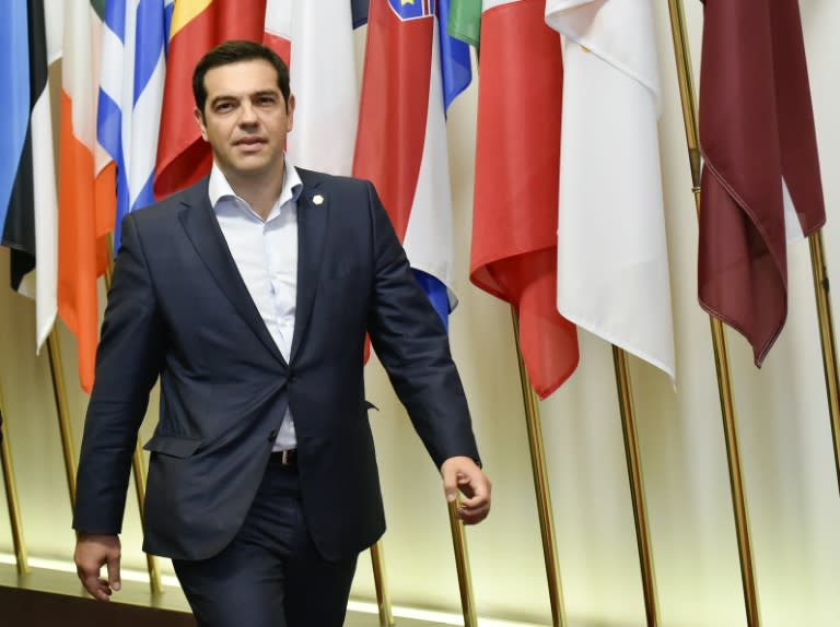 Greek Prime Minister Alexis Tsipras arrives to speak to journalists after an EU summit in Brussels on June 26, 2015