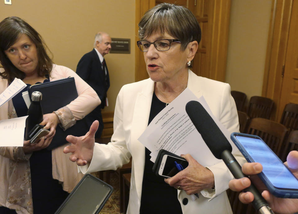 Kansas Gov. Laura Kelly speaks with reporters following a meeting with top legislative leaders, Wednesday, June 5, 2019, at the Statehouse in Topeka, Kansas. Top Republicans in the GOP-controlled Legislature blocked nearly $10 million in spending sought by the Democratic governor's administration to deal with prison overcrowding.(AP Photo/John Hanna)