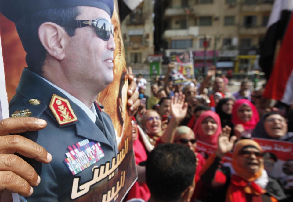 People chant pro-military slogans in Tahrir square as they celebrate the anniversary of an attack on Israeli forces during the 1973 war, in Cairo