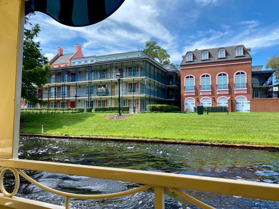 view of disney's port orleans french quarter from the transportation boats at disney world