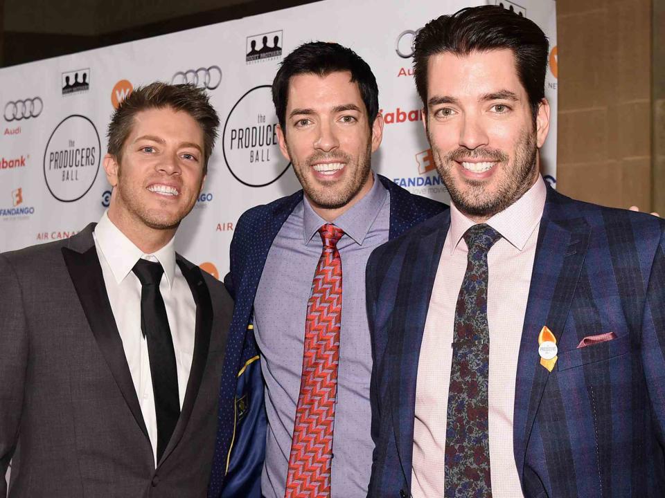 <p>Mike Windle/Getty</p> J.D. Scott, Drew Scott and Jonathan Scott attend the 5th Annual Producers Ball on September 11, 2015 in Toronto, Canada.