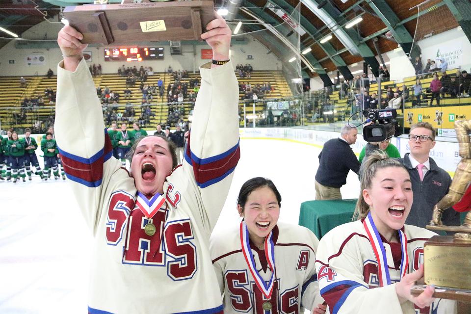 The Spaulding High School girls hockey team celebrates after winning the Division I state championship with a 4-1 win over Burlington/Colchester at Gutterson Fieldhouse on Wednesday, March 8, 2023.