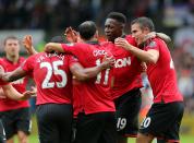 Manchester United's Danny Welbeck (center right) celebrates scoring his side's second goal of the game with teammates.