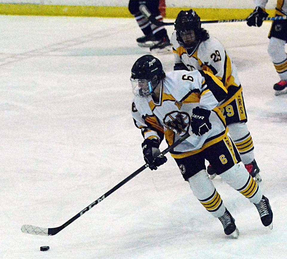 Ryan Roby of the Watertown Lakers handles the puck in front of teammate Trey Allard during a South Dakota Amateur Hockey Association game against Brandon Valley on Saturday, Feb. 11, 2023 in the Maas Ice Arena.