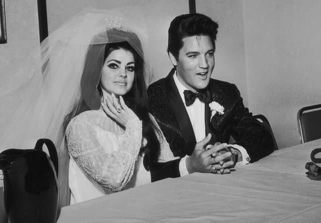 <p>Frank Edwards/Fotos International/Archive Photos/Getty</p> Elvis Presley and Priscilla Ann Beaulieu following their wedding on May 1, 1967.