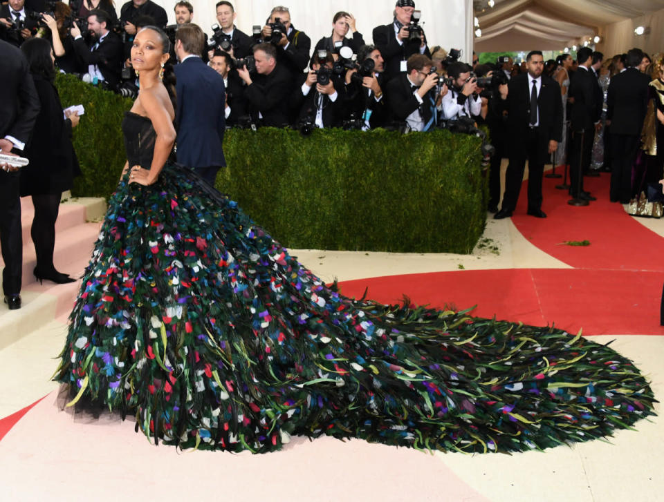 Zoe Saldana in a gown with a massive feather train 