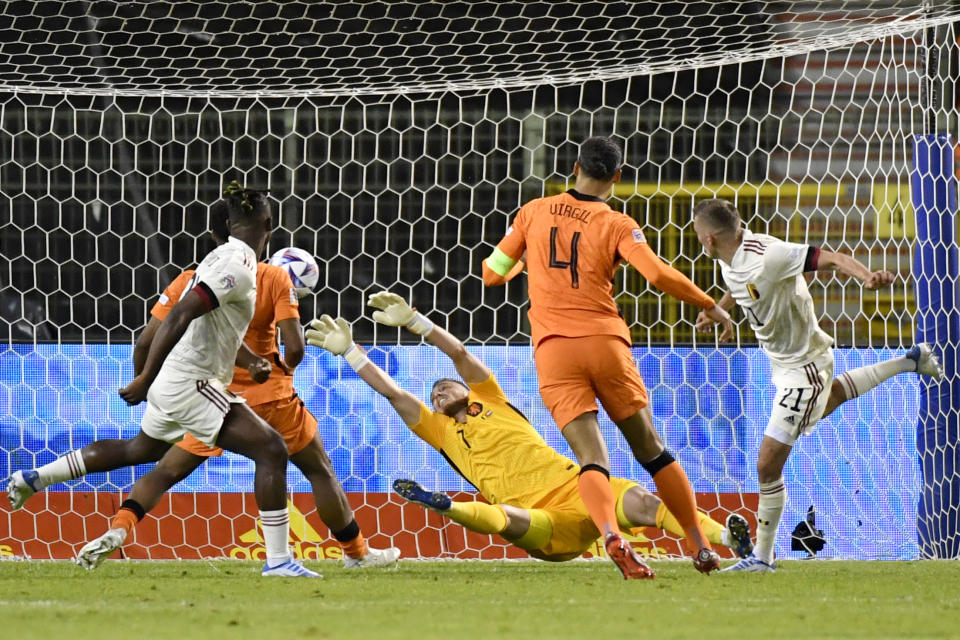 Belgium's Timothy Castagne, right, scores a goal disallowed for offside during the UEFA Nations League soccer match between Belgium and the Netherlands, at the King Baudouin Stadium in Brussels, Friday, June 3, 2022. (AP Photo/Geert Vanden Wijngaert)