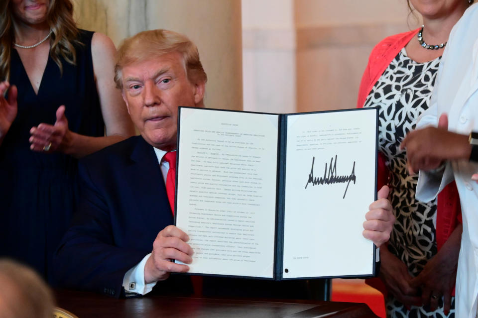 U.S. President Donald Trump signs an executive order aimed at requiring hospitals to be more transparent about prices before charging patients for healthcare services, at the White House in Washington, U.S. June 24, 2019. REUTERS/Erin Scott