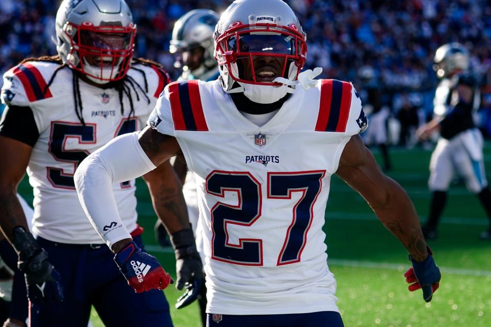 New England Patriots cornerback J.C. Jackson celebrates after an interception in the end zone during the second half of an NFL football game against the Carolina Panthers Sunday, Nov. 7, 2021, in Charlotte, N.C. (AP Photo/John Bazemore)