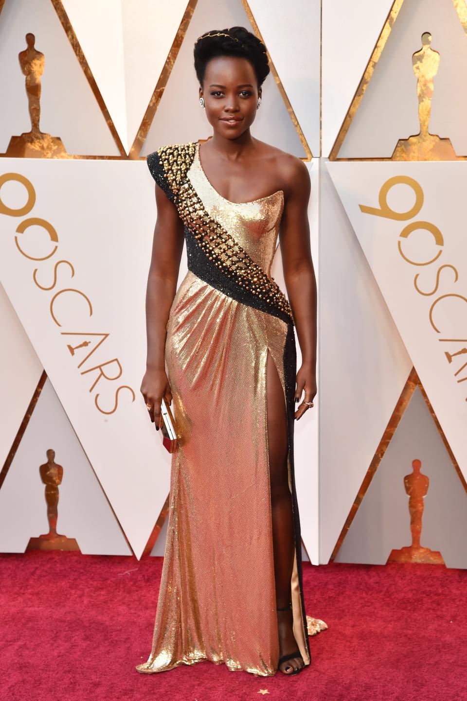 Lupita Nyong’o in custom Atelier Versace, Alexandre Birman shoes, Niwaka jewelry, and with a Versace clutch