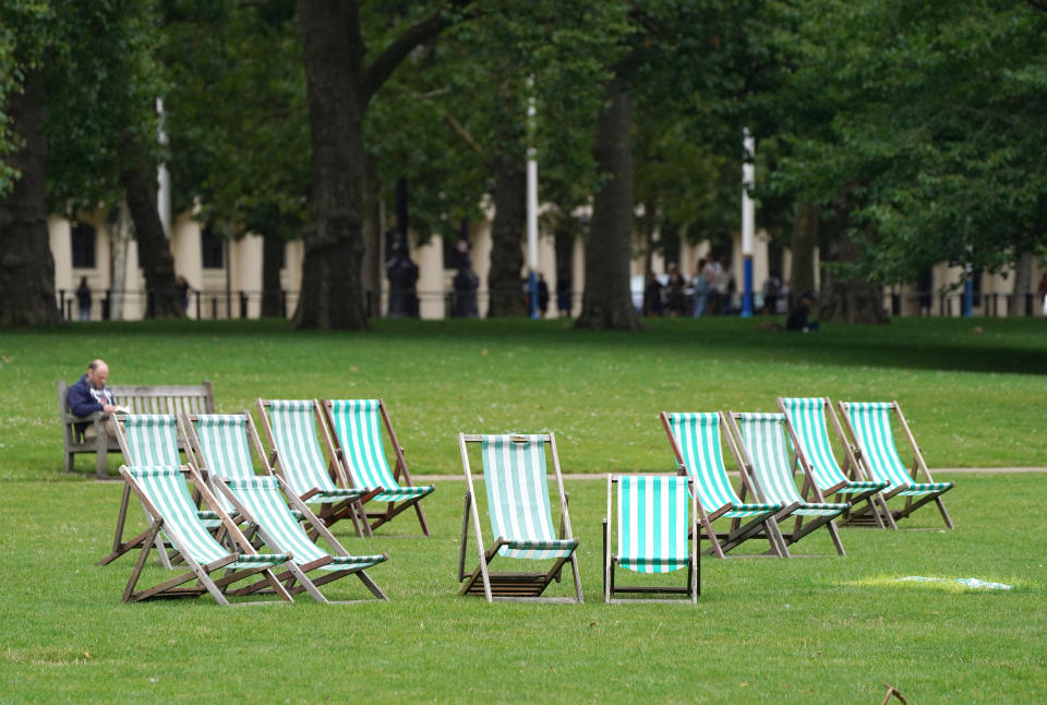 <p>Empty deck chairs in St. James Park in London. Picture date: Monday August 2, 2021.</p>
