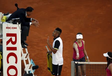 Nick Kyrgios of Australia argues with the umpire during his match against Roger Federer of Switzerland at the Madrid Open tennis tournament in Madrid, Spain, May 6, 2015. REUTERS/Susana Vera