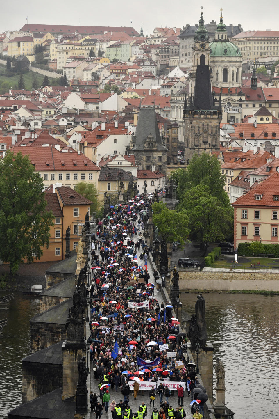 Thousands of people take part in a march in the centre of Prague, Monday April 29, 2019, to protest the proposed replacement of the justice minister. The protesters said Monday it might compromise the legal system at a time when prosecutors have to decide whether to indict Prime Minister Andrej Babis over alleged fraud involving European Union funds. (Vit Simanek/CTK via AP)