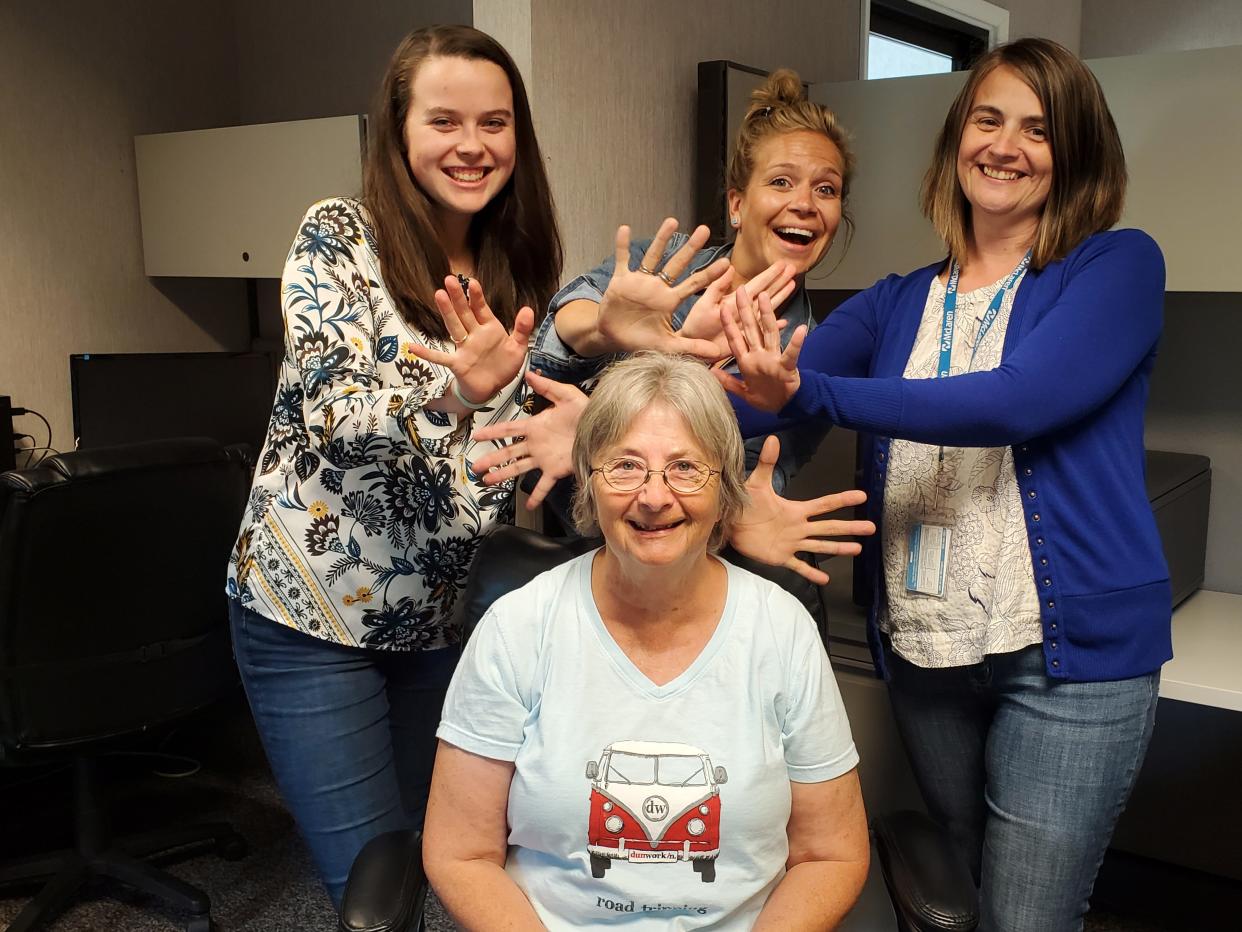 Joan Sorensen sits front and center being celebrated for her 50 years in nursing.