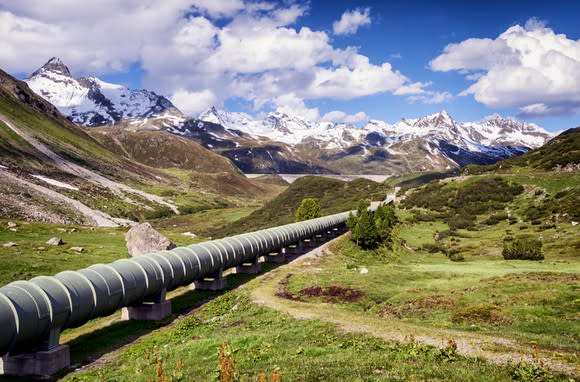 A pipeline splitting a mountain valley.