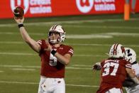 Wisconsin quarterback Graham Mertz throws a pass during the first half of an NCAA college football game against Illinois Friday, Oct. 23, 2020, in Madison, Wis. (AP Photo/Morry Gash)