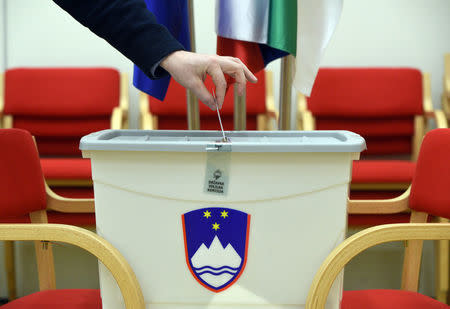 A man casts his vote at a polling station during the presidential election in Grosuplje, Slovenia October 22, 2017. REUTERS/Borut Zivulovic