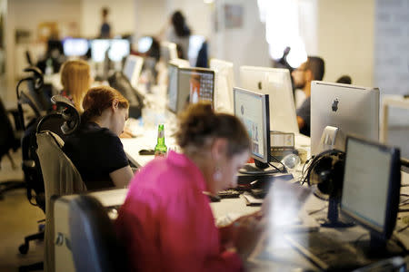 Employees work at the offices of "Time Out Tel Aviv" magazine in Tel Aviv, Israel September 28, 2017. REUTERS/Amir Cohen