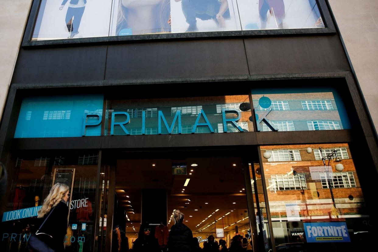Shoppers walk past a Primark store on Oxford Street in London: REUTERS