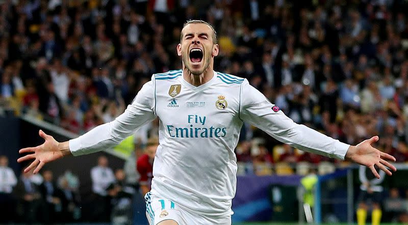 FILE PHOTO: Real Madrid's Gareth Bale celebrates scoring their second goal in a 3-1 Champions League final win over Liverpool. Bale's brace and errors by Liverpool keeper Loris Karius gave the Spanish side a third straight title in the competition.