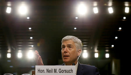 FILE PHOTO: U.S. Supreme Court nominee judge Neil Gorsuch responds to a question as he testifies during the third day of his Senate Judiciary Committee confirmation hearing on Capitol Hill in Washington, U.S. on March 22, 2017. REUTERS/Jim Bourg/File Photo