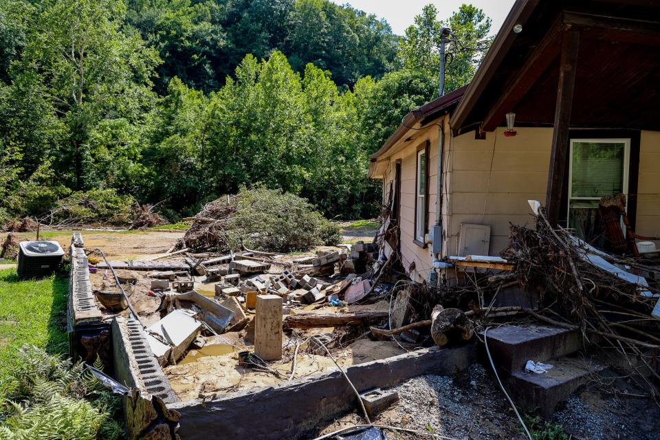 A flood lifted a home in Pilgrim's Knob, Va., from its foundation.